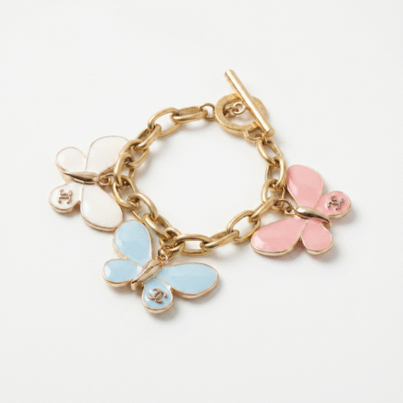 chanel butterfly charms on a gold chain
