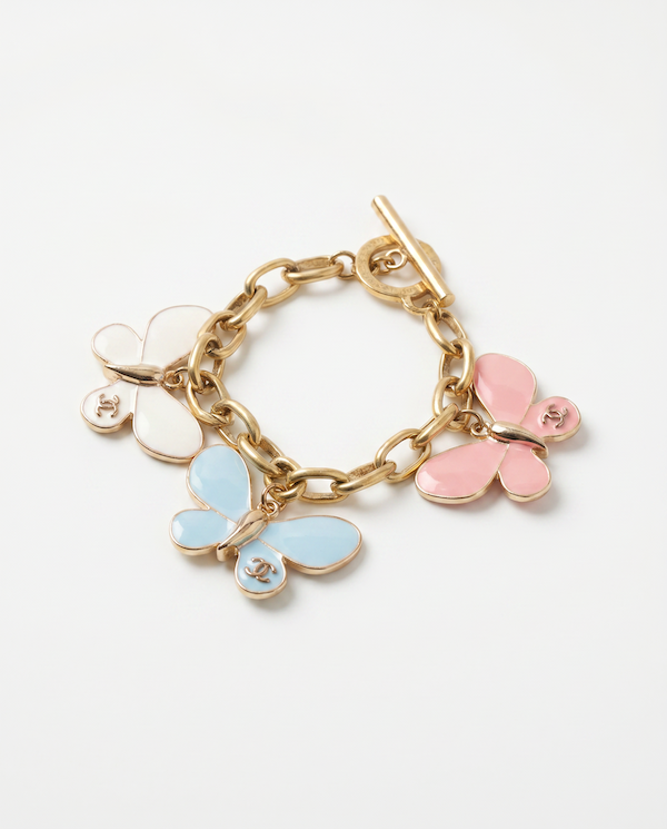 chanel butterfly charms on a gold chain